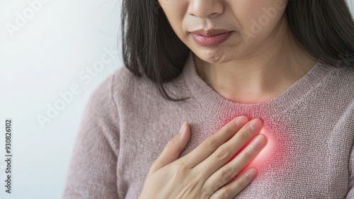 A woman with a red hand on her chest