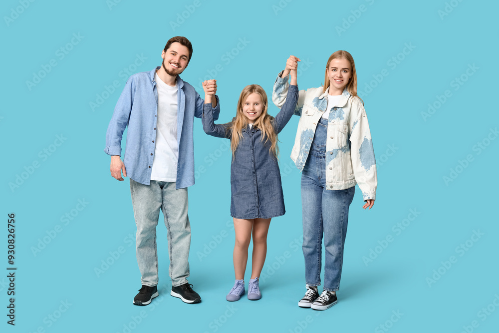 Fototapeta premium Happy family in stylish denim clothes on blue background