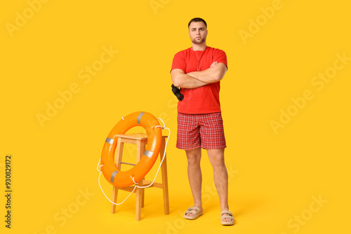 Young lifeguard with lifebu...