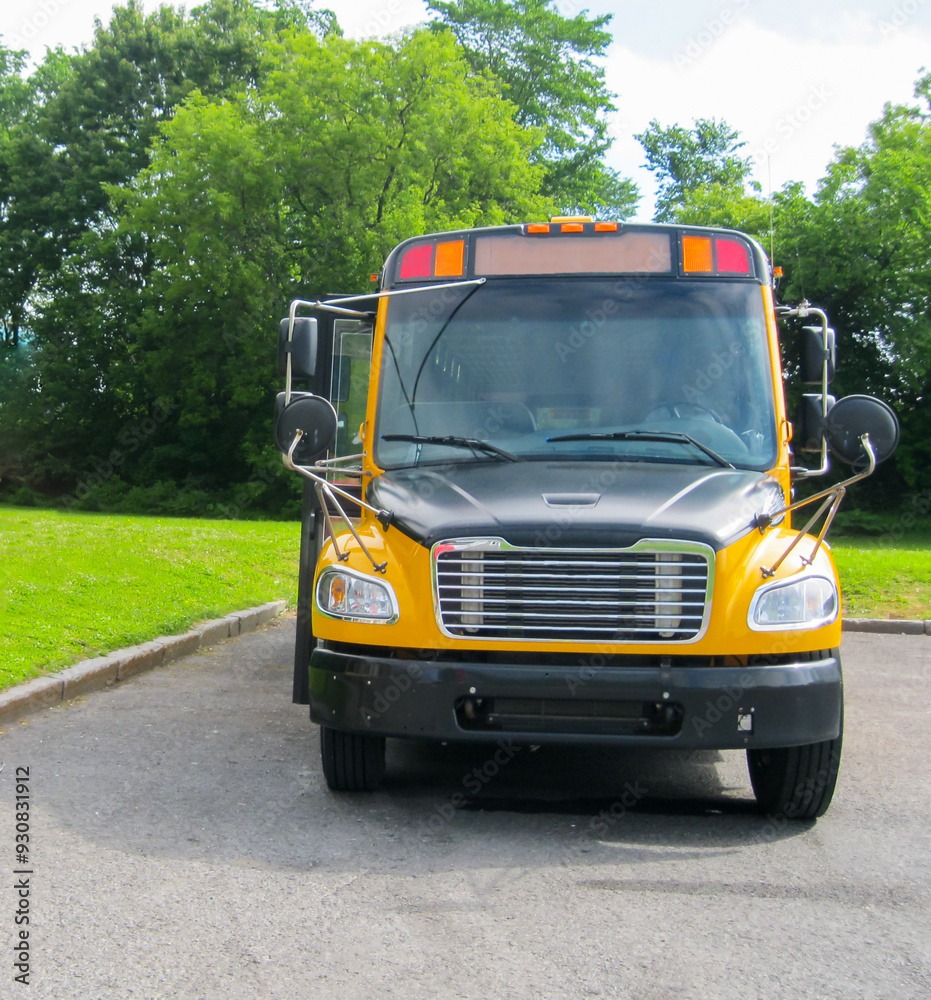 School bus parked ready to start picking up students for a back to school background concept. School bus parked ready to start picking up students for a back to school background concept.