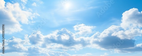 Panoramic banner of a blue sky with clouds and ample copy space, ideal for backgrounds and design use.