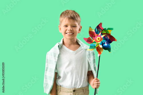 Smiling young boy holding c...
