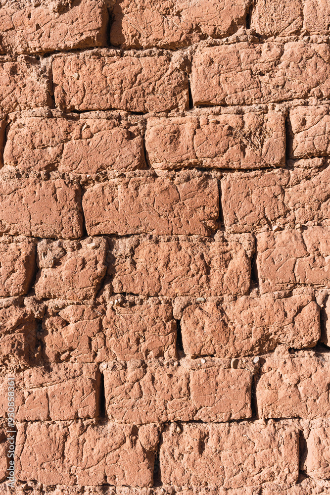 Texture of earth and adobe wall with cracks and grooves in the Andes mountain range Texture of earth and adobe wall with cracks and grooves in the Andes mountain range