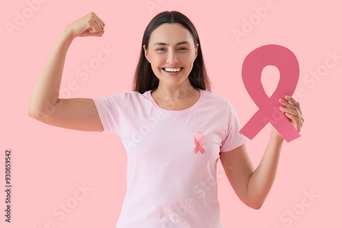 Young woman with pink ribbo...