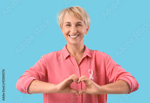 Mature woman with pink ribb...