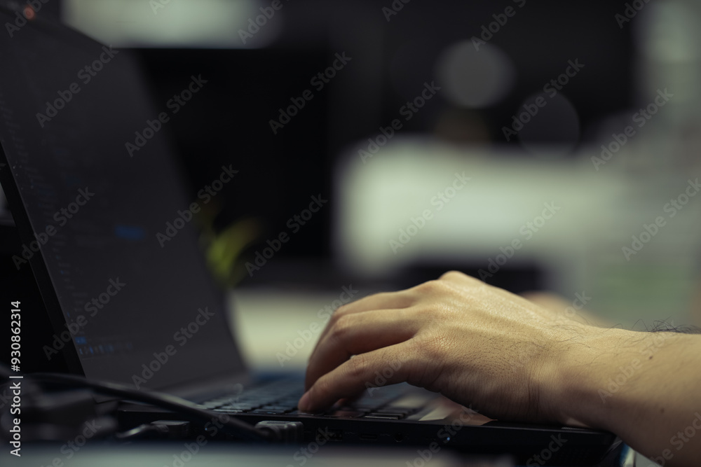 Close up person working on laptop, hands of businessman typing on keyboard in dark tone. Close up person working on laptop, hands of businessman typing on keyboard in dark tone.