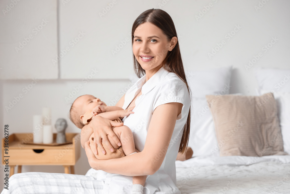 Happy mother with her little baby sitting in bedroom Happy mother with her little baby sitting in bedroom