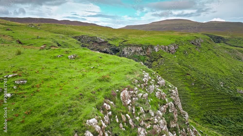 Aerial view of Scottish highlands falls in Scotland. Waterfall landscape in the United Kingdom. Scenic drone view of waterfalls on the Isle of Skye. Aerial view of Scottish highlands falls in Scotland. Waterfall landscape in the United Kingdom. Scenic drone view of waterfalls on the Isle of Skye.