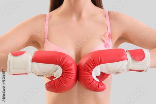 Young woman in bra with pin...