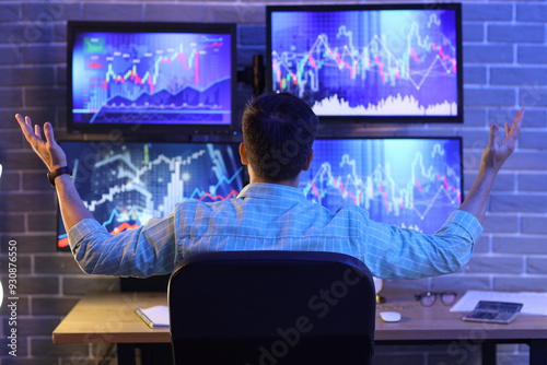 Male trader working in offi...
