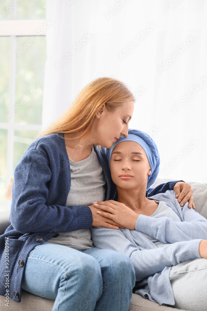Young woman after chemotherapy with her mother hugging at home Young woman after chemotherapy with her mother hugging at home