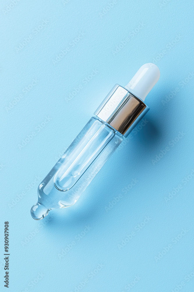 High Angle Shot of Transparent Serum Dropper with Single Cosmetic Smear Isolated on Soft Blue Background, Skincare Product, Beauty Treatment, Minimalist Design, Clean Aesthetic, Modern Cosmetics High Angle Shot of Transparent Serum Dropper with Single Cosmetic Smear Isolated on Soft Blue Background, Skincare Product, Beauty Treatment, Minimalist Design, Clean Aesthetic, Modern Cosmetics