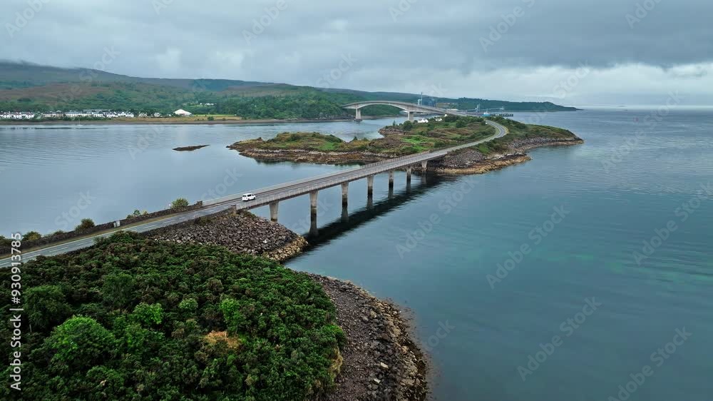 Aerial view of concrete road bridge Skye Bridge on the Isle of Skye. Bridge linking mainland Scotland and the Isle of Skye via Eilean Bàn wildlife reserve. Aerial view of concrete road bridge Skye Bridge on the Isle of Skye. Bridge linking mainland Scotland and the Isle of Skye via Eilean Bàn wildlife reserve.