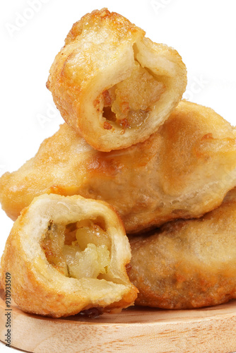 Fried stuffed Cireng, a traditional Indonesian snack filled with seasoned beef fat or jando, perfect with chili sauce dip, photographed against a white background. photo