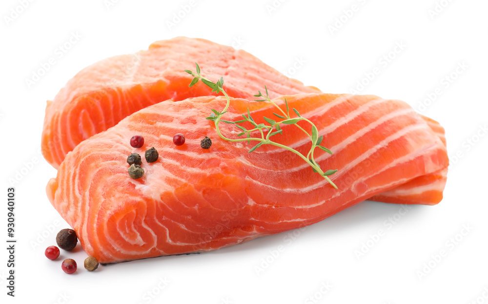 Pieces of fresh salmon, peppercorns and thyme isolated on white Pieces of fresh salmon, peppercorns and thyme isolated on white