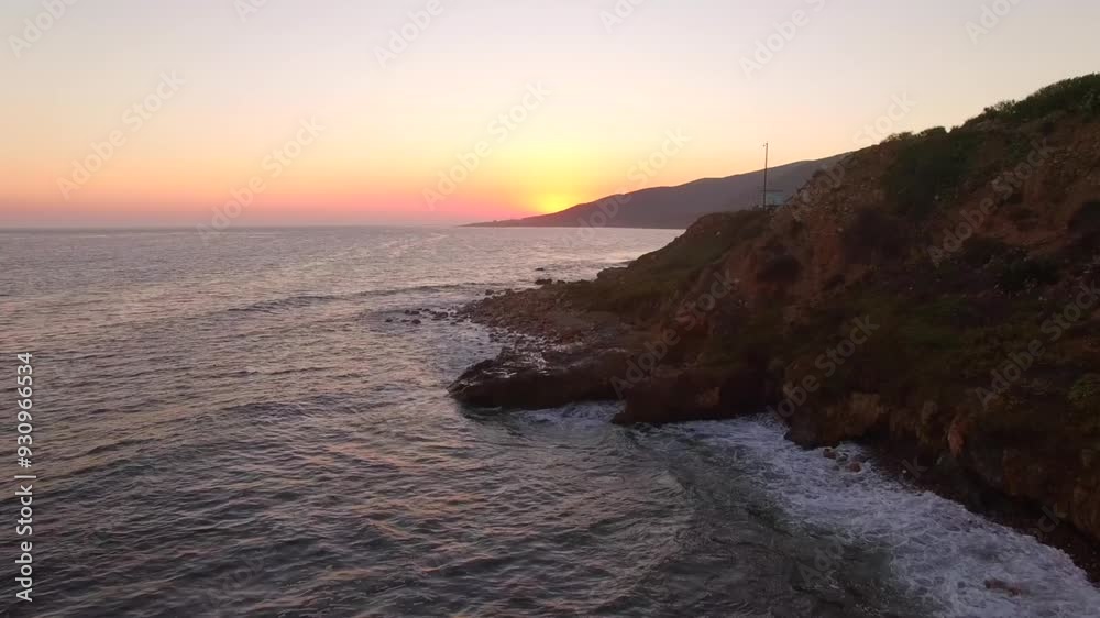 Aerial: Drone Forward Shot Of Sea Waves Splashing On Tranquil Mountains Against Clear Sky During Sunset - Melbourne, Australia Aerial: Drone Forward Shot Of Sea Waves Splashing On Tranquil Mountains Against Clear Sky During Sunset - Melbourne, Australia