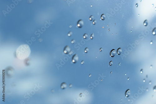 Wallpaper Mural water drop on mirror with blue sky and white cloud background Torontodigital.ca