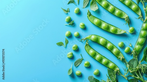 Organic ripe green peas and pods on blue background