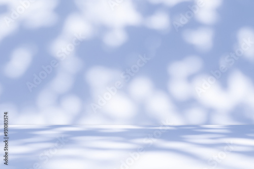 Studio style background wall decoration presentation uses white and blue tones. with shadows cast from a nearby window, concept creating a decorative backdrop.