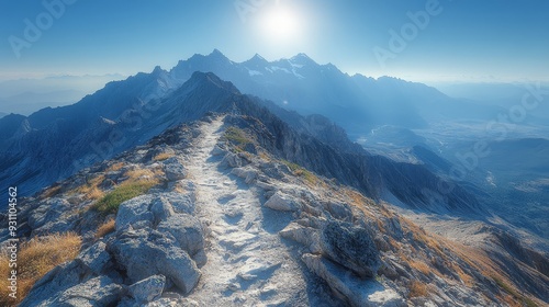 A rocky mountain ridge with a winding trail leadin  847 mountain, landscape, snow, sky, mountains, nature, winter, peak, alps, travel, view, high, rock, panorama, clouds, cloud, forest, ice, summer, a photo