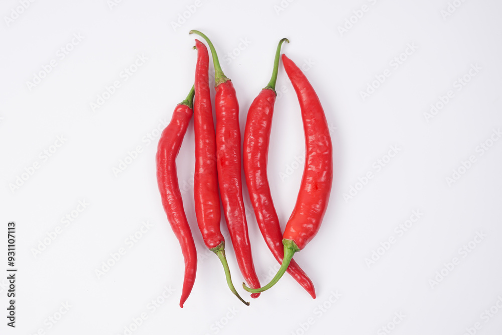 Fresh red chilli pepper on white background. File contains clipping paths. Closeup top view red chili pepper with sliced, raw food ingredient concept. Red hot chili peppers isolated, selective focus.