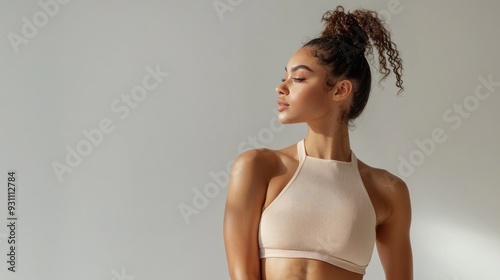 Caucasian fitness model with toned body and confident posture.