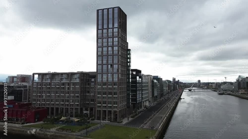 A still shot with a drone of Capital Dock with Dublin city in the background.