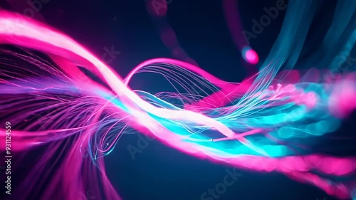 Illuminated fiber optic strands swirl in darkness. Vibrant pink and teal light trails create a sense of speed and connectivity. Motion blur enhances the dynamic visual effect.
