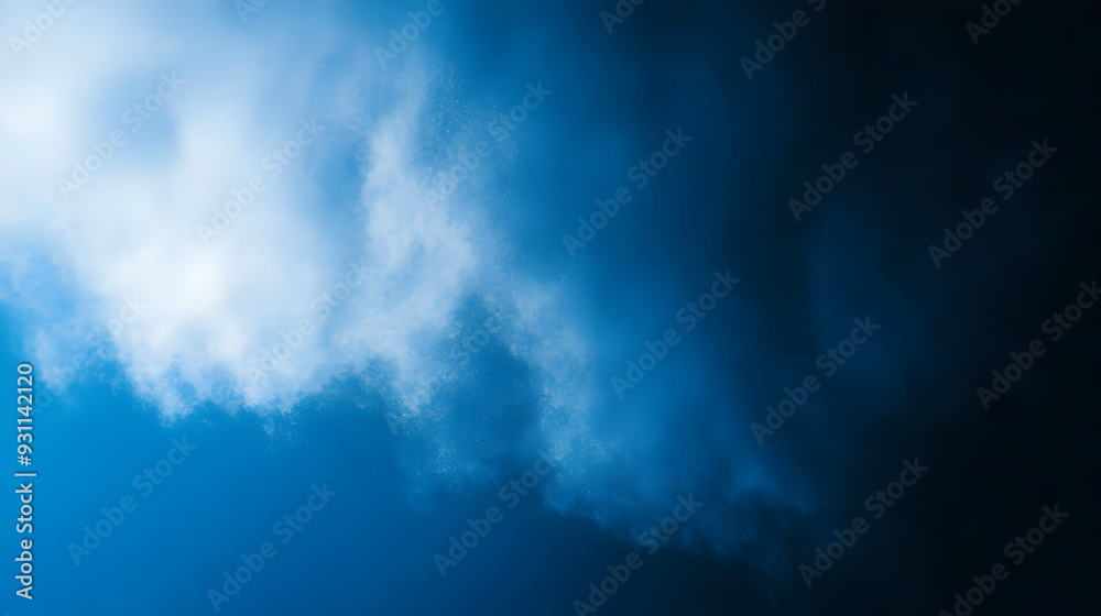 A dramatic cloud formation against a blue backdrop. A dramatic cloud formation against a blue backdrop.