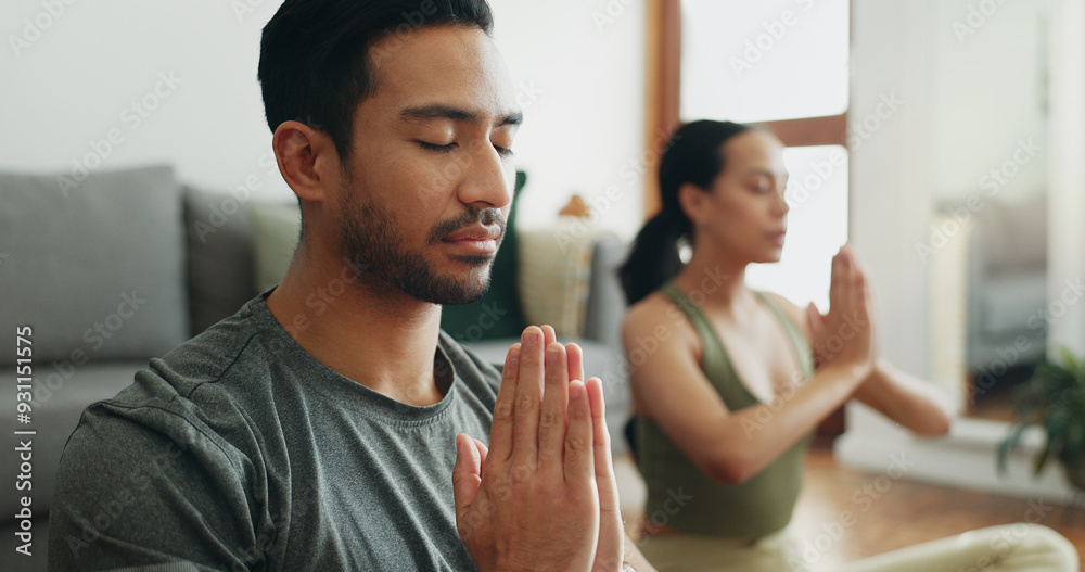 Couple, man and namaste with meditation in home for holistic wellness, mindfulness and relax on floor with zen. People, praying hands and spiritual healing in living room for yoga, pilates or bonding Couple, man and namaste with meditation in home for holistic wellness, mindfulness and relax on floor with zen. People, praying hands and spiritual healing in living room for yoga, pilates or bonding