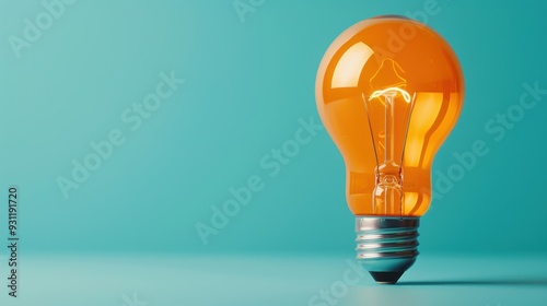 A close-up of an orange lightbulb against a plain background, with soft, diffused lighting to create a calming and minimalist atmosphere. The image is ideal for projects that need a simple yet