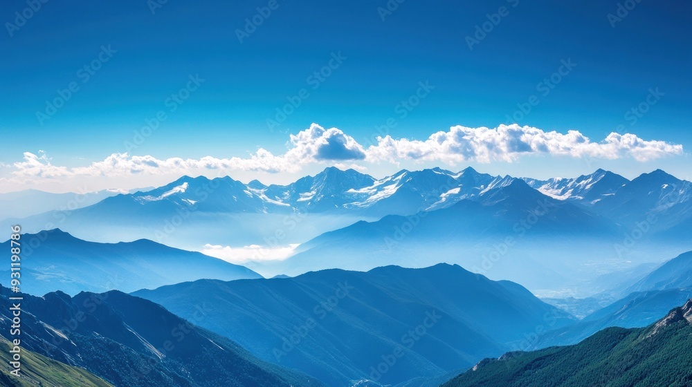 Expansive View of a Mountain Range with a Blue Sky and White Clouds Expansive View of a Mountain Range with a Blue Sky and White Clouds