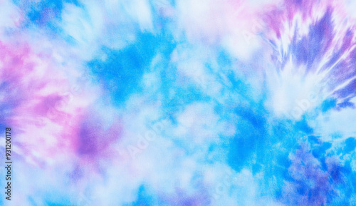Abstract tie-dye background in blue and purple hues with swirling patterns.
