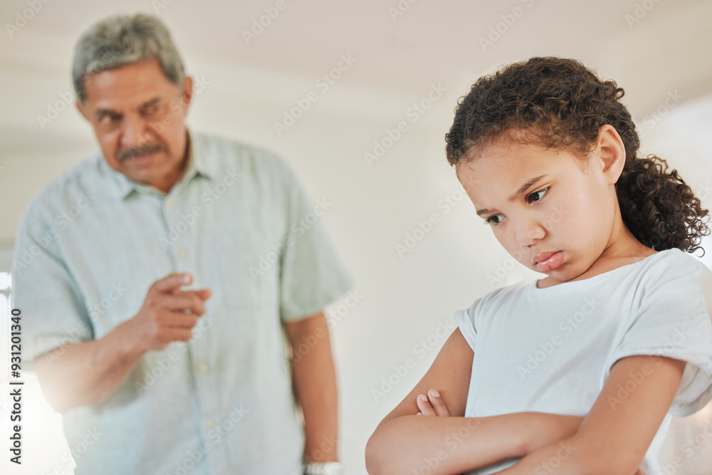 Obraz premium Senior man, annoyed and girl in home with point, babysitting or discipline for behavior in Mexico. Elderly person, grandfather and scold at child with arms crossed, frustrated or talk in family house
