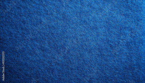 Close-up of a blue felt fabric texture with soft fibers.