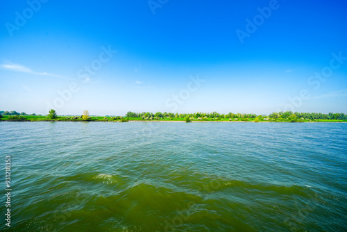 View of the banks of the Rhine between Rees and Emmerich am Rhein. Landscape by the river.
 photo