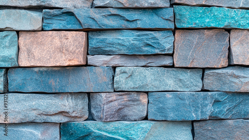 Coarse stone wall texture in turquoise and coral tones for World Ocean Day rugged surface with subtle wave like patterns capturing marine themes and ocean conservation  photo