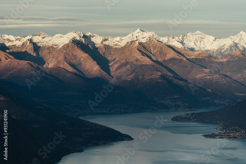 Stunning aerial view of Lake Como and Italian Alps from the summit of Monte San Primo, during a winter sunset