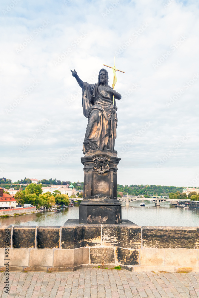 Obraz premium Statue of Saint John the Baptist by Josef Max on Charles Bridge, Prague, Czech Republic