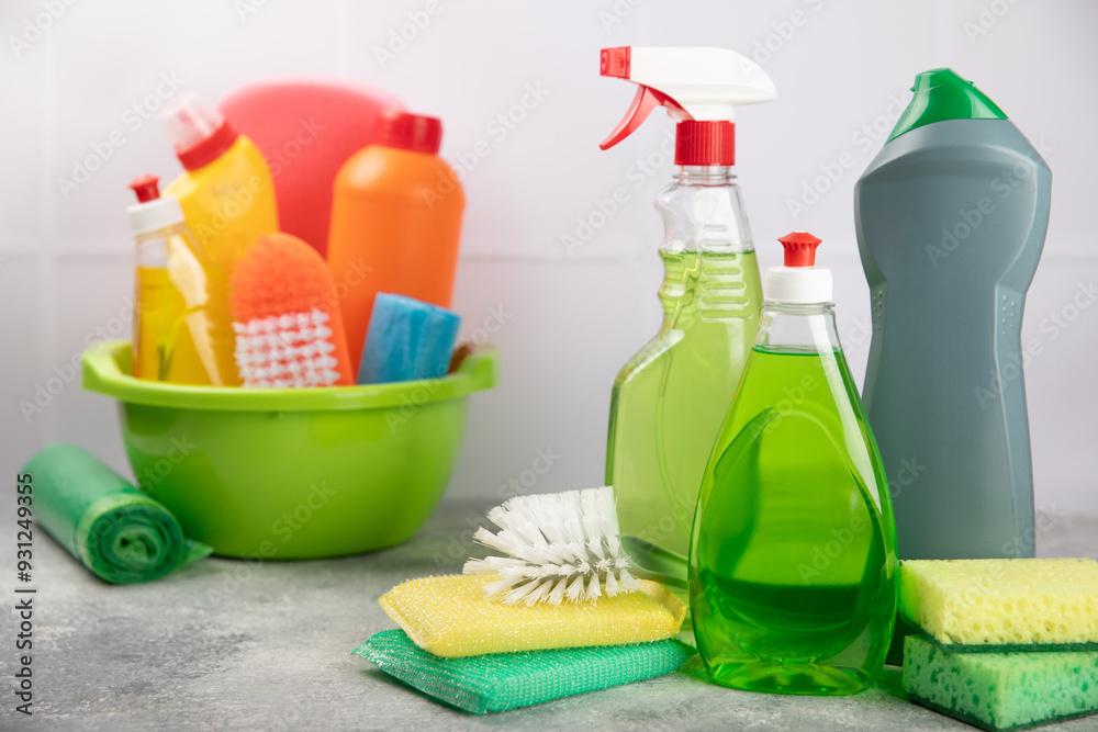 Cleaning service concept.Home cleaning product on a pink background. Bucket with household chemicals. cleaning supplies for home or office space.Early spring regular cleaning. Copy space