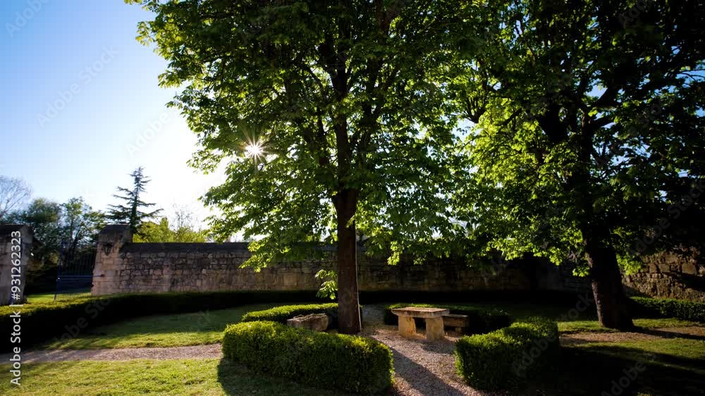 Slow orbiting shot of stone benches in a chateau garden in France Slow orbiting shot of stone benches in a chateau garden in France