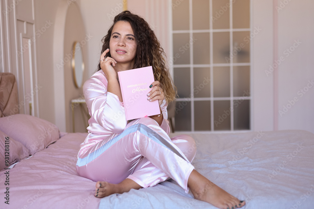 Girl read her notebook, write some notes. A beautiful curly-haired girl in a pink silk pajamas lies on the bed, relaxed. A middle-aged woman is getting ready for bed in the morning, smiling. Girl read her notebook, write some notes. A beautiful curly-haired girl in a pink silk pajamas lies on the bed, relaxed. A middle-aged woman is getting ready for bed in the morning, smiling.