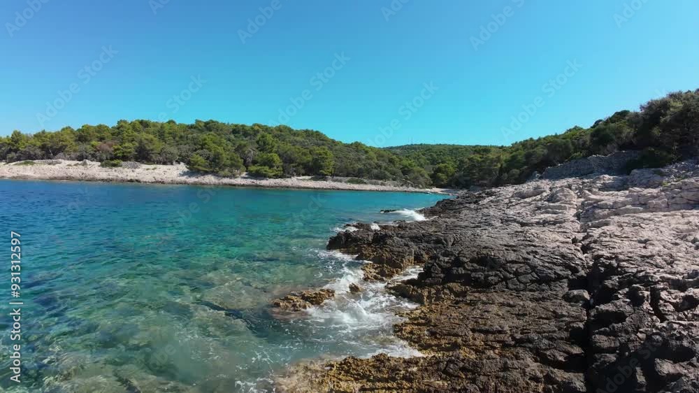 Bird's eye aerial movement of the Mali Losinj island shoreline at midday, Croatia. Bird's eye aerial movement of the Mali Losinj island shoreline at midday, Croatia.