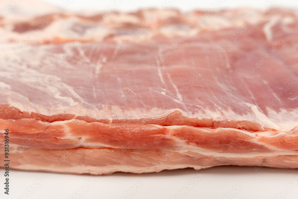 A piece of meat with a white background. The meat is cut in half and has a pinkish color Pork meat isolated on a white background. A piece of meat with a white background. The meat is cut in half and has a pinkish color Pork meat isolated on a white background.