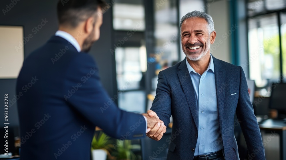 Confident Businessmen Handshake in Modern Office Setting Confident Businessmen Handshake in Modern Office Setting