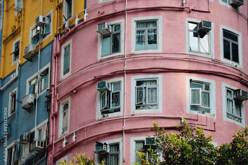 Colorful round building in the heart of Hong Kong with vibrant hues and unique architecture Colorful round building in the heart of Hong Kong with vibrant hues and unique architecture