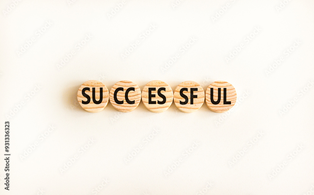 Successful symbol. Concept word Successful on beautiful wooden circles. Beautiful white background. Business successful concept. Copy space. Successful symbol. Concept word Successful on beautiful wooden circles. Beautiful white background. Business successful concept. Copy space.