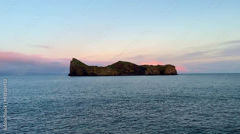 Elliðaey island at Iceland’s Vestmannaeyjar and open ocean seen from boat