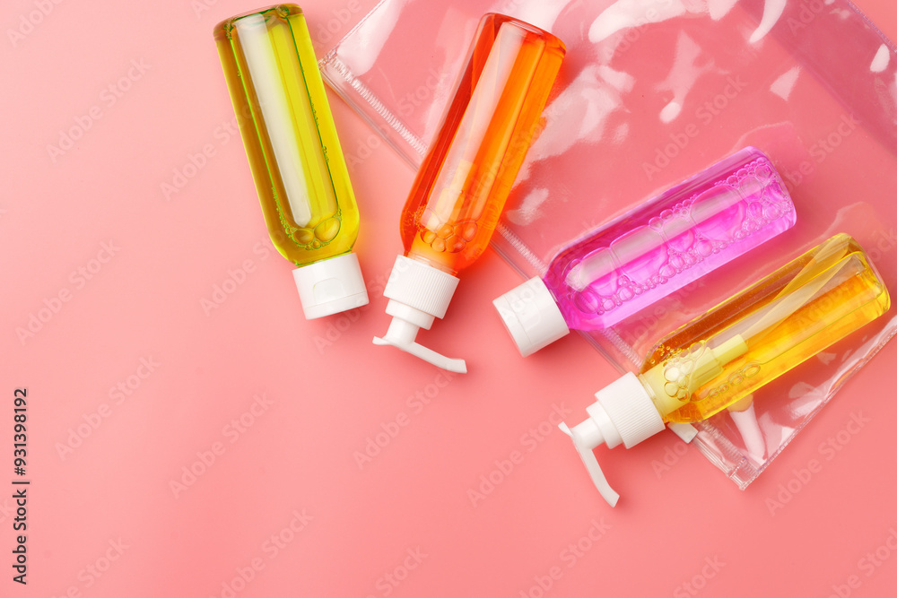 Clear Plastic Bag Containing Travel-Sized Toiletries on Pink Background Clear Plastic Bag Containing Travel-Sized Toiletries on Pink Background