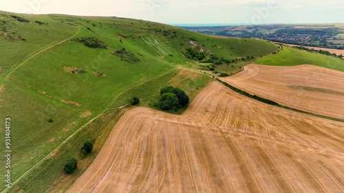 Aerial drone footage showcases the Long Man of Wilmington, an ancient hill figure etched into the steep slopes of Windover Hill, Wilmington, Sussex, England. photo